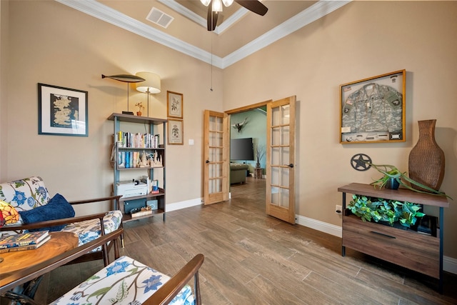 134 Southern Ct, Springtown, TX 76082 - living area with french doors, ornamental molding, wood finished floors, a ceiling fan, and baseboards