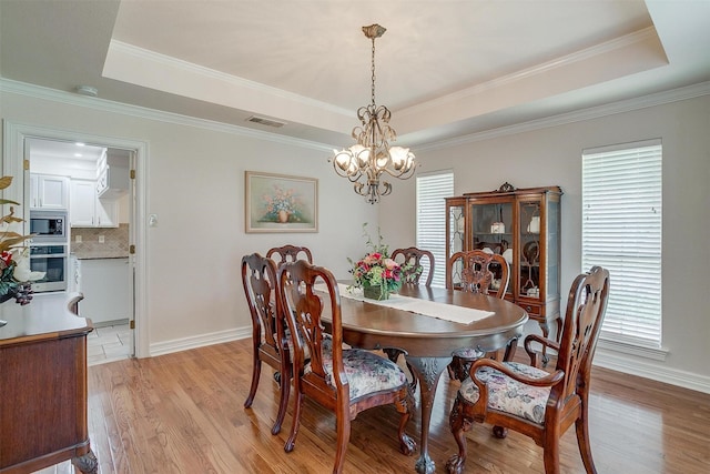 8921 Crest Ridge Dr, Fort Worth, TX 76179 - dining room with a tray ceiling, healthy amount of natural light, a chandelier, and ornamental molding