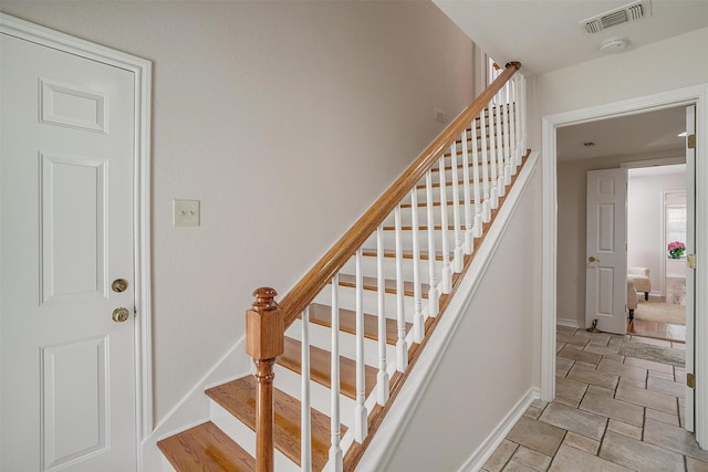 8921 Crest Ridge Dr, Fort Worth, TX 76179 - stairway featuring baseboards and stone finish flooring