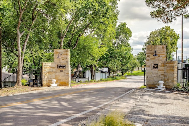 8921 Crest Ridge Dr, Fort Worth, TX 76179 - view of asphalt street featuring a gate