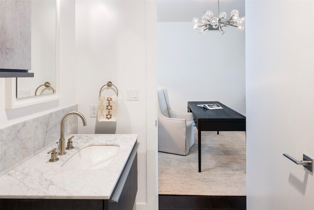 3130 N Harwood St Unit 1804, Dallas, TX 75201 - bathroom featuring vanity and a chandelier