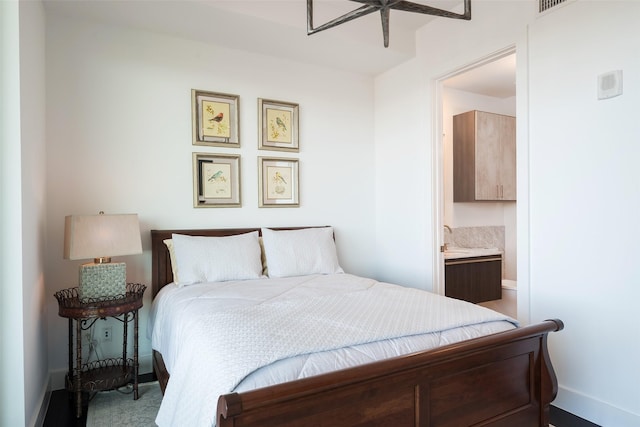 3130 N Harwood St Unit 1804, Dallas, TX 75201 - bedroom featuring baseboards and ensuite bath