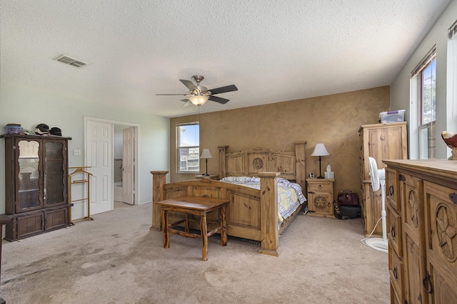 1400 Sunflower Ct, Burleson, TX 76028 - bedroom featuring light carpet, a textured ceiling, and a ceiling fan