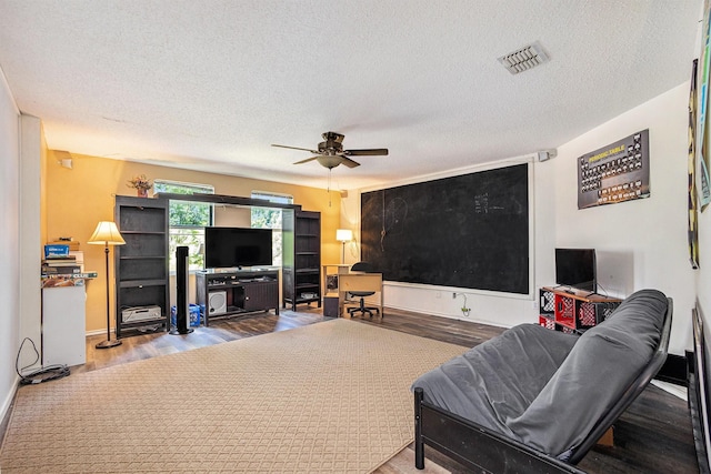 1400 Sunflower Ct, Burleson, TX 76028 - living area with a textured ceiling, a ceiling fan, and wood finished floors