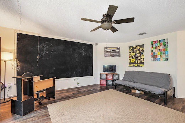 1400 Sunflower Ct, Burleson, TX 76028 - sitting room with wood finished floors, a ceiling fan, and a textured ceiling