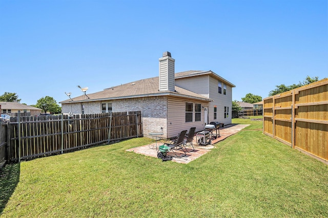 1400 Sunflower Ct, Burleson, TX 76028 - back of property featuring a patio, a chimney, and brick siding