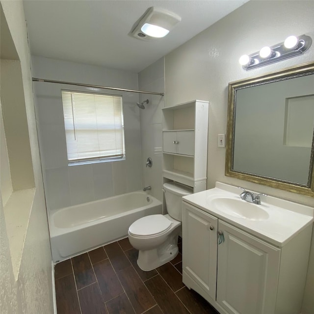 313 Wall St, Terrell, TX 75160 - bathroom featuring wood tiled floors, toilet, shower / washtub combination, and vanity