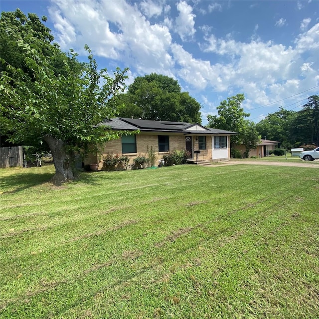 313 Wall St, Terrell, TX 75160 - single story home with a front yard and brick siding