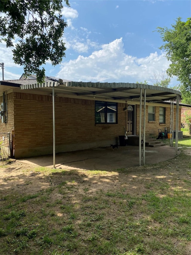 313 Wall St, Terrell, TX 75160 - back of house with brick siding