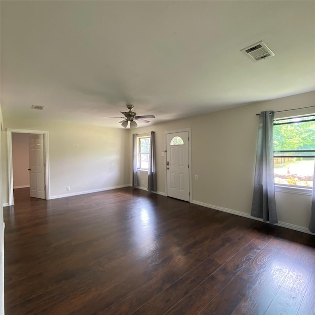 313 Wall St, Terrell, TX 75160 - foyer entrance featuring dark wood finished floors, ceiling fan, and baseboards