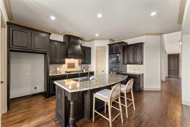 647 Gillon Way, Rockwall, TX 75087 - kitchen with stainless steel appliances, a sink, custom exhaust hood, backsplash, and recessed lighting
