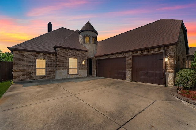 647 Gillon Way, Rockwall, TX 75087 - french country style house with brick siding, driveway, an attached garage, and roof with shingles