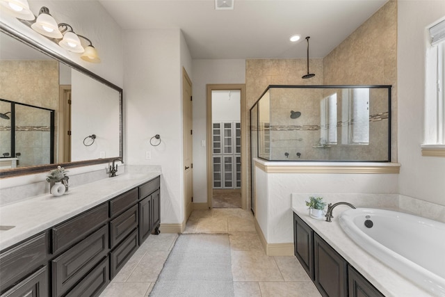 647 Gillon Way, Rockwall, TX 75087 - full bath featuring a shower stall, double vanity, a garden tub, tile patterned flooring, and baseboards