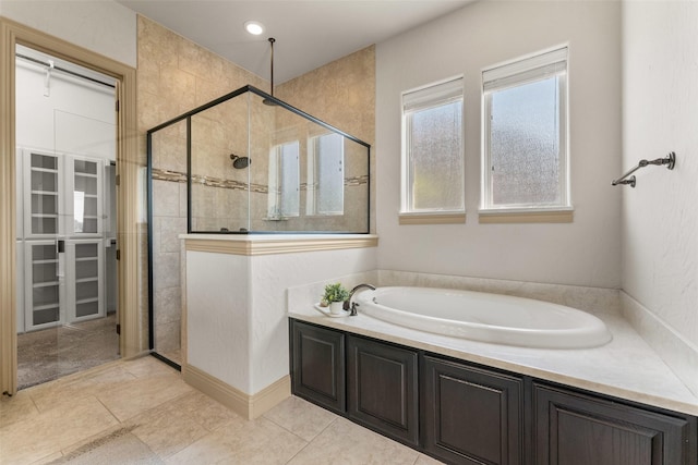 647 Gillon Way, Rockwall, TX 75087 - full bath featuring a stall shower, a garden tub, and tile patterned floors