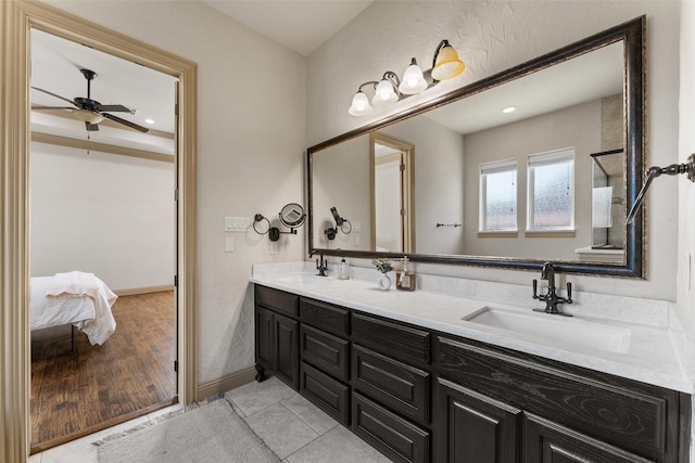 647 Gillon Way, Rockwall, TX 75087 - full bath featuring double vanity, ceiling fan, baseboards, and ensuite bath