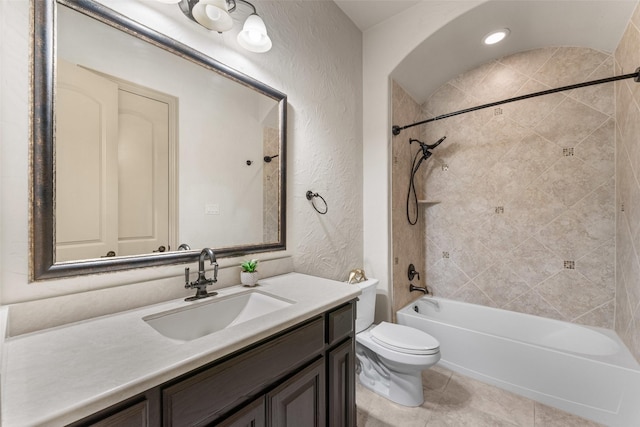 647 Gillon Way, Rockwall, TX 75087 - bathroom with vanity, toilet, a textured wall, shower / washtub combination, and tile patterned floors