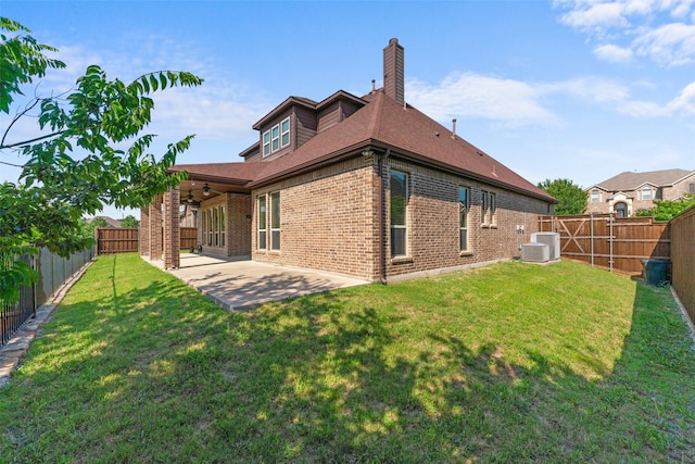 647 Gillon Way, Rockwall, TX 75087 - rear view of house with brick siding, a ceiling fan, a chimney, central AC unit, and a patio