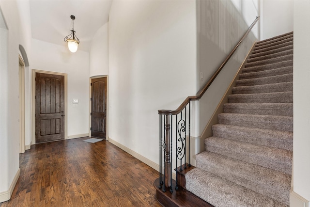 647 Gillon Way, Rockwall, TX 75087 - entryway with wood finished floors, stairway, a towering ceiling, and baseboards