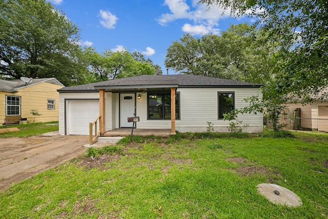 841 20th St SE, Paris, TX 75460 - view of front of house with a porch, driveway, a garage, and a shingled roof