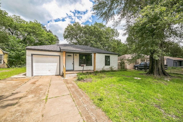 841 20th St SE, Paris, TX 75460 - view of front facade with an attached garage, concrete driveway, a front yard, and a porch