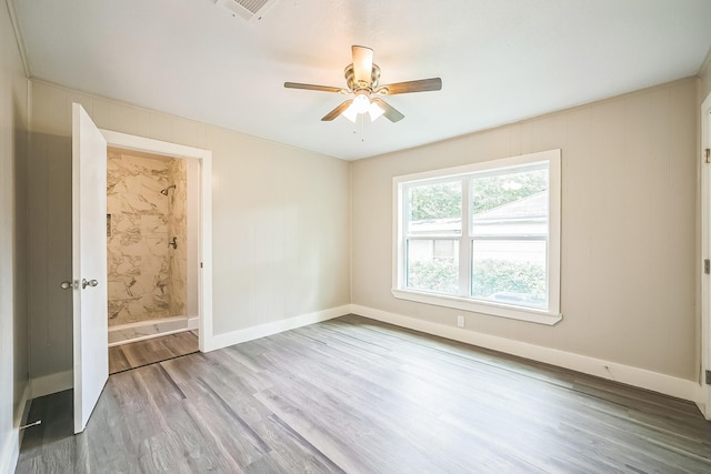 841 20th St SE, Paris, TX 75460 - empty room with wood finished floors, ceiling fan, and baseboards