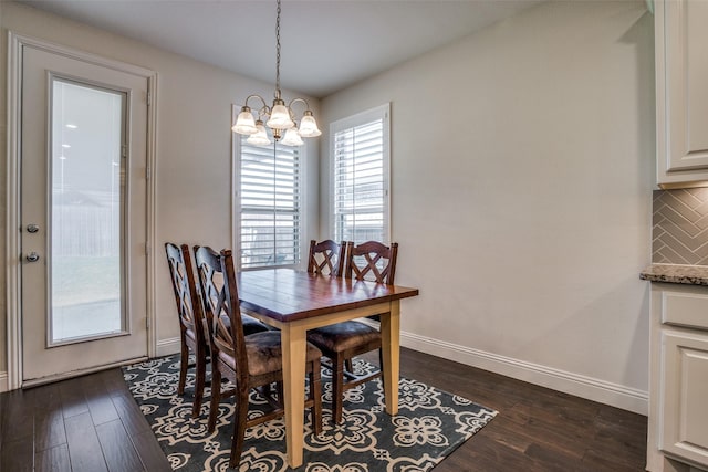 1137 Olympic Dr, Celina, TX 75009 - dining area with a chandelier, dark wood-style floors, and baseboards
