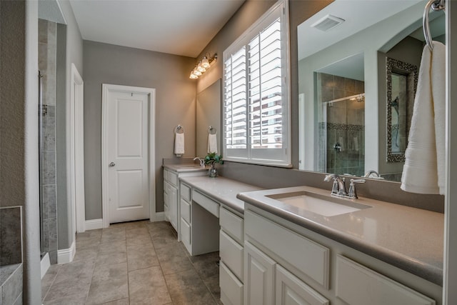 1137 Olympic Dr, Celina, TX 75009 - bathroom featuring double vanity, a shower stall, tile patterned floors, and baseboards