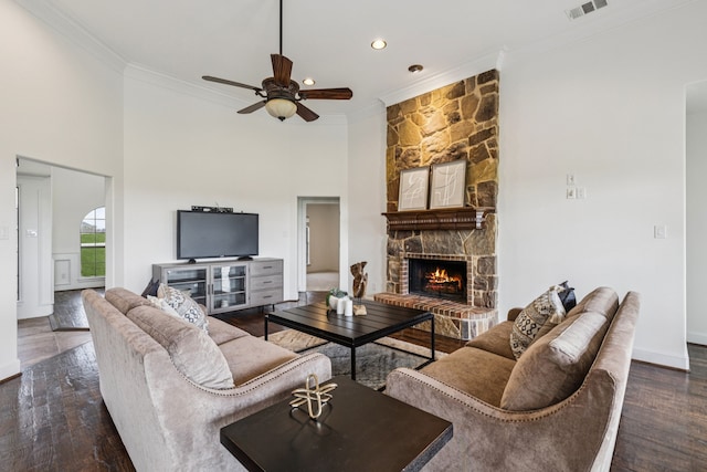 3076 W Alamosa Dr, Terrell, TX 75160 - living area featuring crown molding, ceiling fan, a fireplace, wood finished floors, and recessed lighting