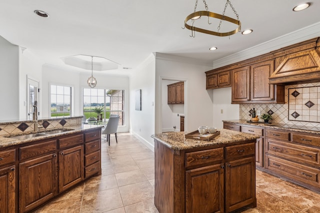 3076 W Alamosa Dr, Terrell, TX 75160 - kitchen with a sink, tasteful backsplash, light stone counters, recessed lighting, and baseboards