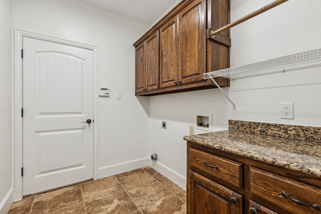 3076 W Alamosa Dr, Terrell, TX 75160 - laundry area with hookup for an electric dryer, washer hookup, cabinet space, baseboards, and light stone finish flooring