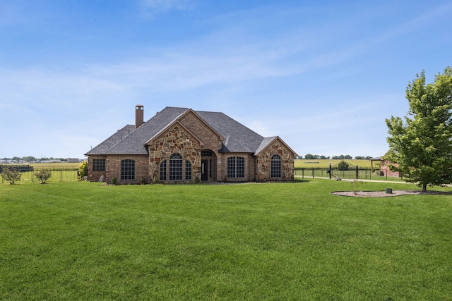3076 W Alamosa Dr, Terrell, TX 75160 - view of front of house featuring stone siding, a chimney, a shingled roof, and brick siding