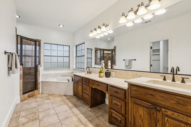 3076 W Alamosa Dr, Terrell, TX 75160 - full bathroom with a shower stall, double vanity, a bath, tile patterned floors, and recessed lighting