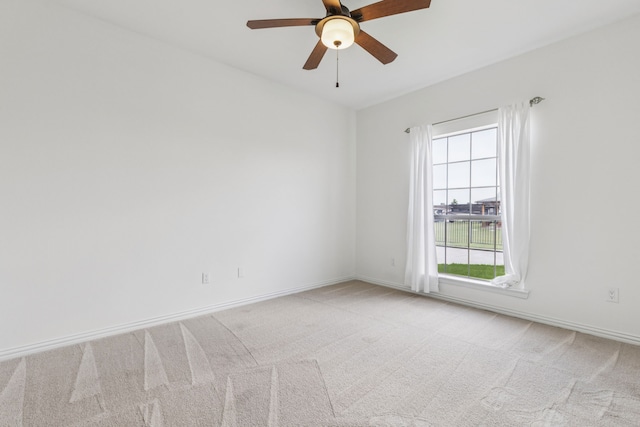 3076 W Alamosa Dr, Terrell, TX 75160 - spare room with light carpet, ceiling fan, and baseboards