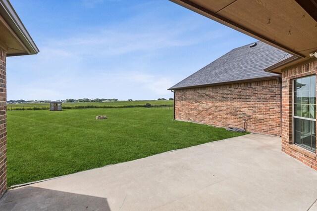 3076 W Alamosa Dr, Terrell, TX 75160 - view of green lawn with a patio area and a view of rural / pastoral area