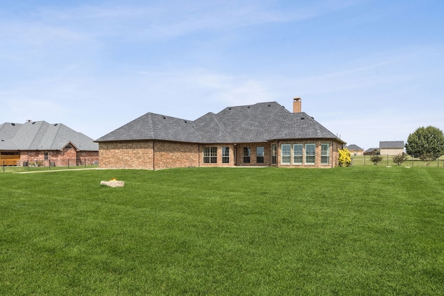 3076 W Alamosa Dr, Terrell, TX 75160 - rear view of house featuring a chimney