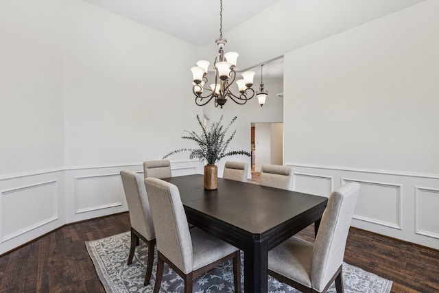 3076 W Alamosa Dr, Terrell, TX 75160 - dining space with a chandelier, dark wood-style flooring, a decorative wall, and wainscoting