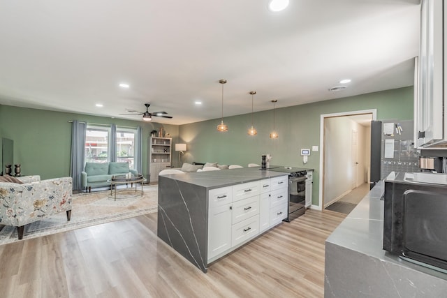 6812 Cumberland Rd, Fort Worth, TX 76116 - kitchen with electric stove, white cabinets, light wood finished floors, recessed lighting, and a peninsula