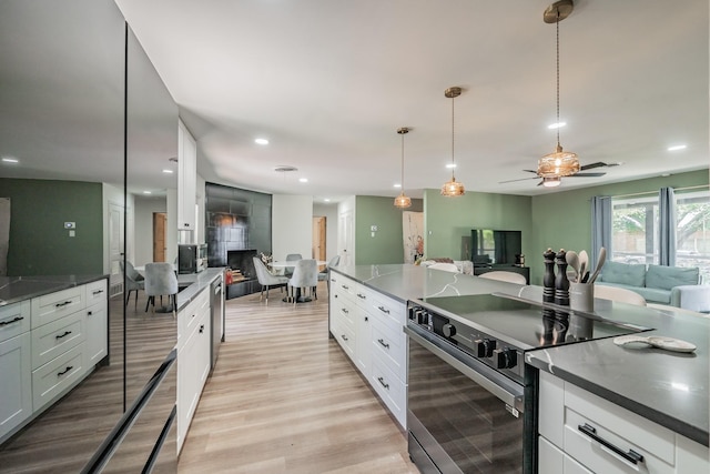 6812 Cumberland Rd, Fort Worth, TX 76116 - kitchen with electric stove, open floor plan, dark countertops, and recessed lighting