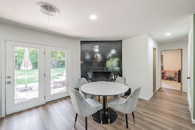 6812 Cumberland Rd, Fort Worth, TX 76116 - dining room with light wood-style flooring, baseboards, recessed lighting, and a large fireplace