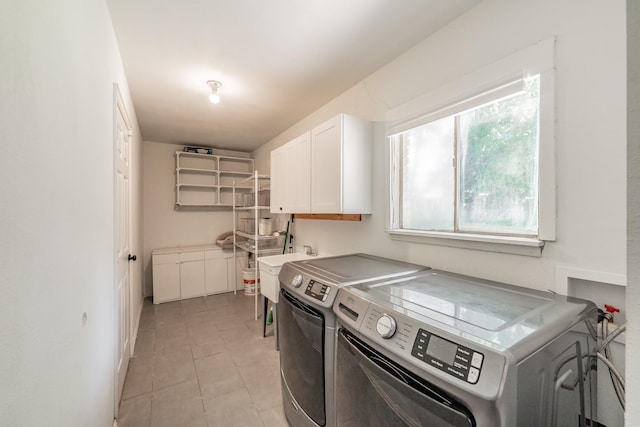 6812 Cumberland Rd, Fort Worth, TX 76116 - washroom with washer and dryer, cabinet space, light tile patterned floors, and baseboards