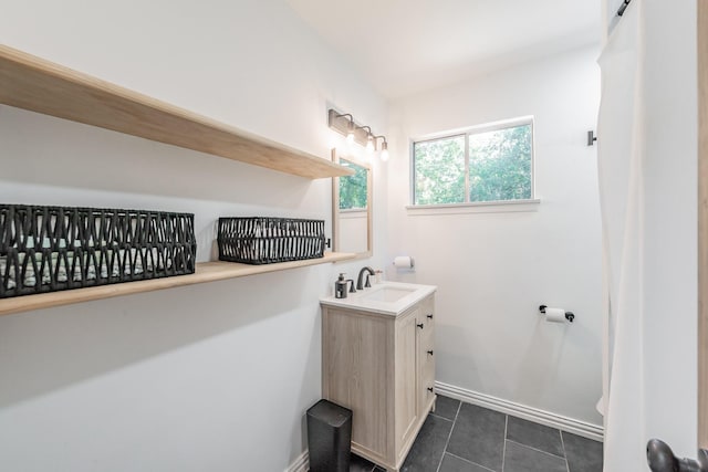6812 Cumberland Rd, Fort Worth, TX 76116 - bathroom with vanity, baseboards, tile patterned floors, and toilet