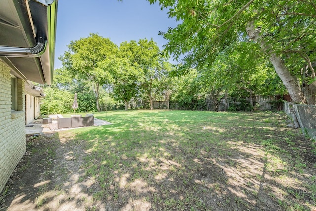 6812 Cumberland Rd, Fort Worth, TX 76116 - view of yard featuring an outdoor living space, a patio, and view of wooded area