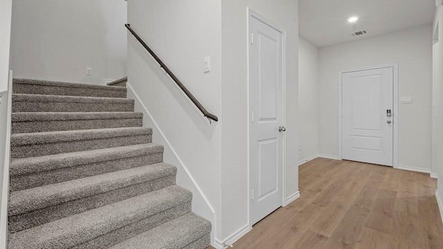 434 Drake Dr, Ferris, TX 75125 - stairway with wood finished floors and recessed lighting