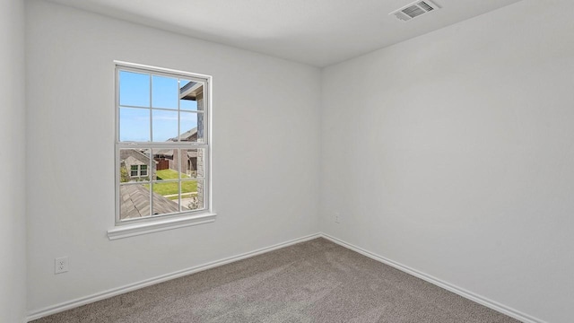 434 Drake Dr, Ferris, TX 75125 - unfurnished room featuring plenty of natural light and carpet flooring