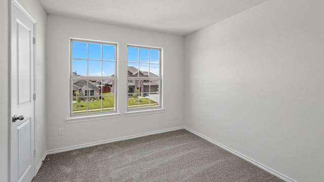 434 Drake Dr, Ferris, TX 75125 - carpeted empty room featuring baseboards