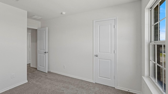 434 Drake Dr, Ferris, TX 75125 - unfurnished bedroom with carpet flooring and baseboards