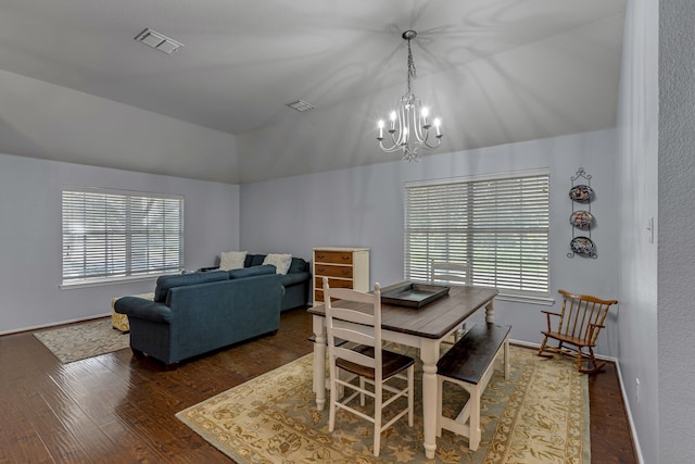 2001 Robincreek Cv, Forney, TX 75126 - dining space featuring lofted ceiling, wood finished floors, a chandelier, and baseboards