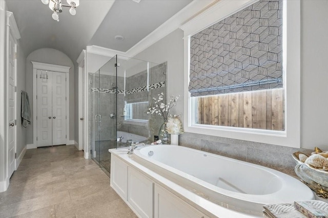 3770 W 5th St, Fort Worth, TX 76107 - bathroom with a garden tub, a shower stall, and baseboards
