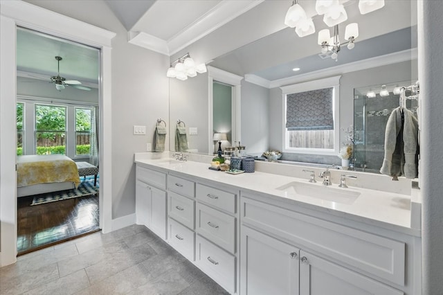 3770 W 5th St, Fort Worth, TX 76107 - bathroom with ornamental molding, ensuite bathroom, double vanity, a chandelier, and baseboards