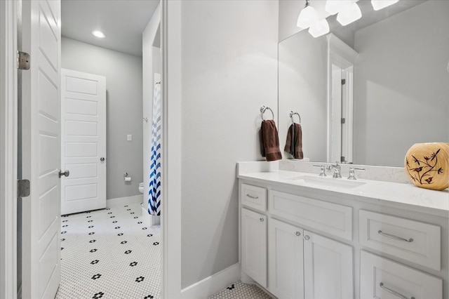 3770 W 5th St, Fort Worth, TX 76107 - bathroom with vanity, baseboards, toilet, recessed lighting, and tile patterned flooring